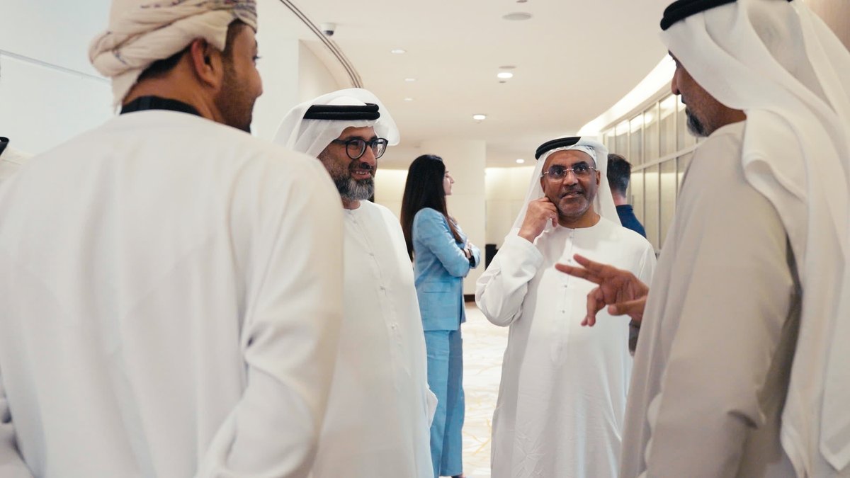 A Board Enhance event in Dubai, with participants in conversation during a networking session.